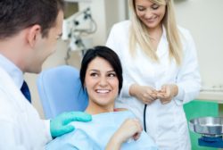 Woman hears about dental procedures dental implants veneers Viera Florida